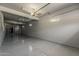 Large three car garage with shelving and plenty of open space at 20452 E Appaloosa Dr, Queen Creek, AZ 85142