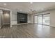 Spacious living room with dark accent wall, recessed lighting, and large sliding doors at 20452 E Appaloosa Dr, Queen Creek, AZ 85142