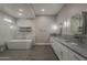 The large main bathroom boasts a soaking tub, walk-in shower, and dual sink vanity at 20452 E Appaloosa Dr, Queen Creek, AZ 85142