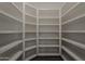 A walk in pantry is fitted with white shelving at 20452 E Appaloosa Dr, Queen Creek, AZ 85142