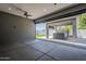 Covered patio with ceiling fan leading to a backyard retreat with a hot tub at 20452 E Appaloosa Dr, Queen Creek, AZ 85142