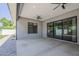 Spacious covered patio featuring ceiling fans and sliding glass doors for indoor/outdoor living at 20452 E Appaloosa Dr, Queen Creek, AZ 85142