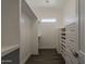 Walk-in closet offers built-in organizers and a window to bring in natural light at 20452 E Appaloosa Dr, Queen Creek, AZ 85142