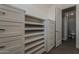 This walk-in closet offers built-in shelving and drawers for maximizing storage at 20452 E Appaloosa Dr, Queen Creek, AZ 85142