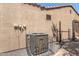 Exterior view of the home's Goodman air conditioning unit, enclosed in protective fencing at 2063 S Edgewater --, Mesa, AZ 85209