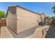 View of the side and back yard featuring rock landscaping, patio, and the home's exterior stucco wall at 2063 S Edgewater --, Mesa, AZ 85209