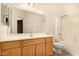 Bright bathroom featuring tile flooring, a toilet, vanity and a shower tub combo at 2063 S Edgewater --, Mesa, AZ 85209