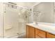 Well-lit bathroom featuring a glass enclosed shower, tile flooring, and vanity with a large mirror at 2063 S Edgewater --, Mesa, AZ 85209