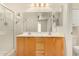 Bathroom featuring double sinks, generous countertop space, and a glass-enclosed walk-in shower at 2063 S Edgewater --, Mesa, AZ 85209