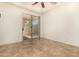 Minimalist bedroom with tile floors and a glass slider door provides outdoor access to a patio at 2063 S Edgewater --, Mesa, AZ 85209
