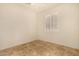 Bedroom with tiled floor and bright natural light from a shuttered window at 2063 S Edgewater --, Mesa, AZ 85209