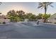 View of the community entrance featuring automatic gates and lush trees surrounding the area at 2063 S Edgewater --, Mesa, AZ 85209