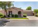 Charming single-story home features a well-manicured lawn and an attached two-car garage at 2063 S Edgewater --, Mesa, AZ 85209
