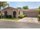 Charming single-story home features a well-manicured lawn and an attached two-car garage at 2063 S Edgewater --, Mesa, AZ 85209