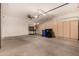 Spacious two-car garage featuring built-in cabinets, ceiling fan, and automatic door at 2063 S Edgewater --, Mesa, AZ 85209