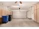 Spacious two car garage with built-in cabinets, ceiling fan, and automatic door at 2063 S Edgewater --, Mesa, AZ 85209