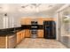 Functional kitchen with stainless steel appliances, granite countertops and backyard access at 2063 S Edgewater --, Mesa, AZ 85209