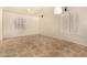 Open concept living room with tile flooring, plantation shutters, and a ceiling fan at 2063 S Edgewater --, Mesa, AZ 85209