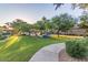 Scenic view of the community's Gathering-friendly playground area with shaded seating and green space at 2063 S Edgewater --, Mesa, AZ 85209
