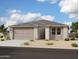 Charming single-story home features a two-car garage, neutral stucco, desert landscaping, and a tile roof at 2367 E Homesteader Rd, San Tan Valley, AZ 85140
