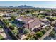 Beautiful aerial view of property, pool, landscaping, mountain views and surrounding neighborhood at 24695 S 195Th Way, Queen Creek, AZ 85142