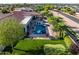 Stunning aerial view of the backyard featuring a pool, putting green, and lush landscaping at 24695 S 195Th Way, Queen Creek, AZ 85142
