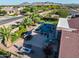 This aerial shows the outdoor kitchen and pool with spa, landscaping and dining area at 24695 S 195Th Way, Queen Creek, AZ 85142