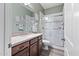 Bathroom featuring a sleek vanity, a walk-in shower with glass door, and contemporary fixtures at 24695 S 195Th Way, Queen Creek, AZ 85142