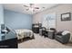 Well-lit bedroom featuring a desk area, ceiling fan, and stylish decor at 24695 S 195Th Way, Queen Creek, AZ 85142