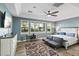 Bright, spacious bedroom with ample natural light, stylish furniture, and a ceiling fan at 24695 S 195Th Way, Queen Creek, AZ 85142