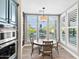 Dining area with a round wooden table and chairs, with views of the pool at 24695 S 195Th Way, Queen Creek, AZ 85142