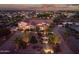Beautiful home with a circular driveway, a well manicured front yard, and a charming stone facade at 24695 S 195Th Way, Queen Creek, AZ 85142
