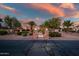 Charming home entrance with stone pillars, lush landscaping, and a well-manicured front yard at 24695 S 195Th Way, Queen Creek, AZ 85142