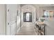 Inviting hallway with views of an elegant front door, chandelier, and stylish decor at 24695 S 195Th Way, Queen Creek, AZ 85142