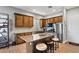 Beautiful kitchen with stainless steel appliances, granite countertops, and a breakfast bar at 24695 S 195Th Way, Queen Creek, AZ 85142