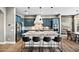 Stunning kitchen features a large island, custom blue cabinetry, and stainless steel appliances at 24695 S 195Th Way, Queen Creek, AZ 85142