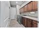 Convenient laundry room with modern washer and dryer, sink, and plenty of cabinet space at 24695 S 195Th Way, Queen Creek, AZ 85142