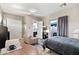 Modern suite with seating area, table, and an adjoining bathroom at 24695 S 195Th Way, Queen Creek, AZ 85142