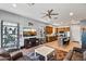 Bright living room with hardwood floors, recessed lighting, and access to the kitchen at 24695 S 195Th Way, Queen Creek, AZ 85142