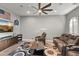 Entertainment room with theater seating, fan and custom built-in at 24695 S 195Th Way, Queen Creek, AZ 85142