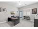 Bright home office with large desk, modern decor, and ample natural light, perfect for productivity at 24695 S 195Th Way, Queen Creek, AZ 85142