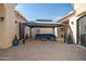 Beautiful covered patio featuring elegant furniture, offering a perfect outdoor living space at 24695 S 195Th Way, Queen Creek, AZ 85142