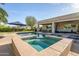 Gorgeous pool and spa area with covered patio and comfortable outdoor seating at 24695 S 195Th Way, Queen Creek, AZ 85142