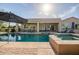 Beautiful pool area with spa and covered patio, great for outdoor entertaining and relaxation at 24695 S 195Th Way, Queen Creek, AZ 85142