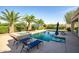 Inviting swimming pool with spa, lounge chairs, and lush landscaping for ultimate relaxation at 24695 S 195Th Way, Queen Creek, AZ 85142
