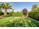 Private putting green in a beautifully landscaped backyard at 24695 S 195Th Way, Queen Creek, AZ 85142