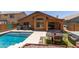 Backyard view featuring pool, patio, hot tub, and the exterior of the home at 25840 W Whyman St, Buckeye, AZ 85326