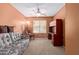 Carpeted home office featuring natural light, desk, and comfortable seating at 25840 W Whyman St, Buckeye, AZ 85326