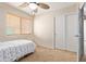 Bright bedroom featuring a ceiling fan, closet, natural light and carpet at 25840 W Whyman St, Buckeye, AZ 85326