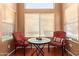 Cozy breakfast nook filled with natural light with table and chairs at 25840 W Whyman St, Buckeye, AZ 85326